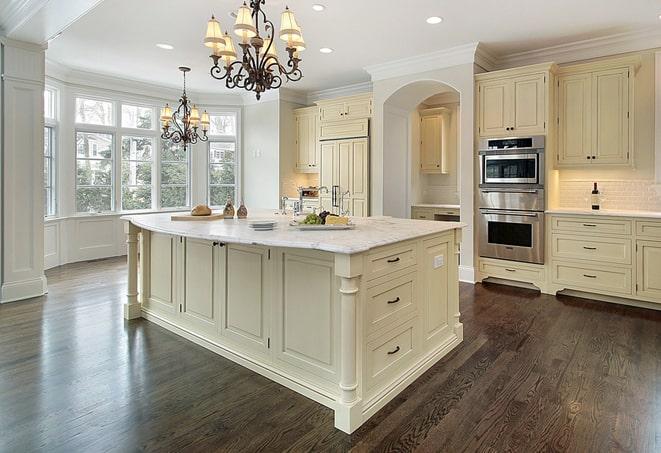 newly installed grey laminate flooring in modern kitchen in Brooklyn